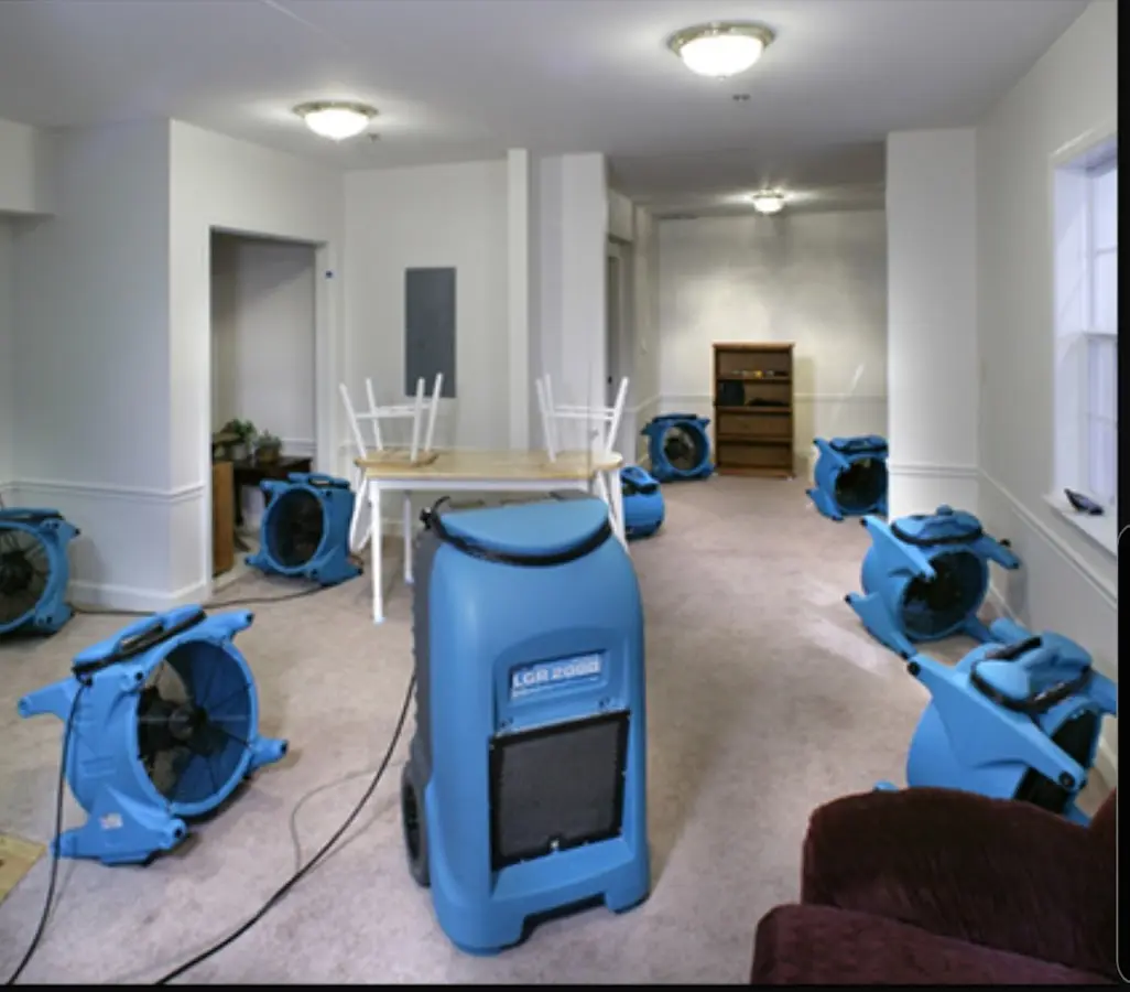 Air movers and dehumidifier setup for Water Damage Restoration in Wolfforth